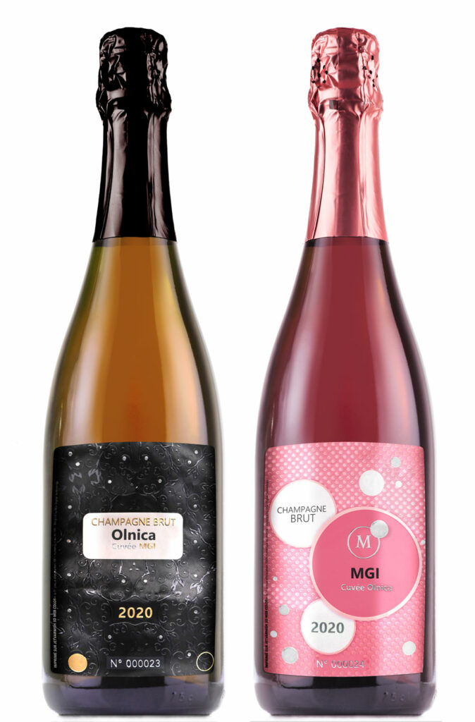 Photo of champagne labels on bottles, one pink with bubbles in varnish, one black with a floral motif in varnish and gilding - finishing on an MGI Digital Technology press