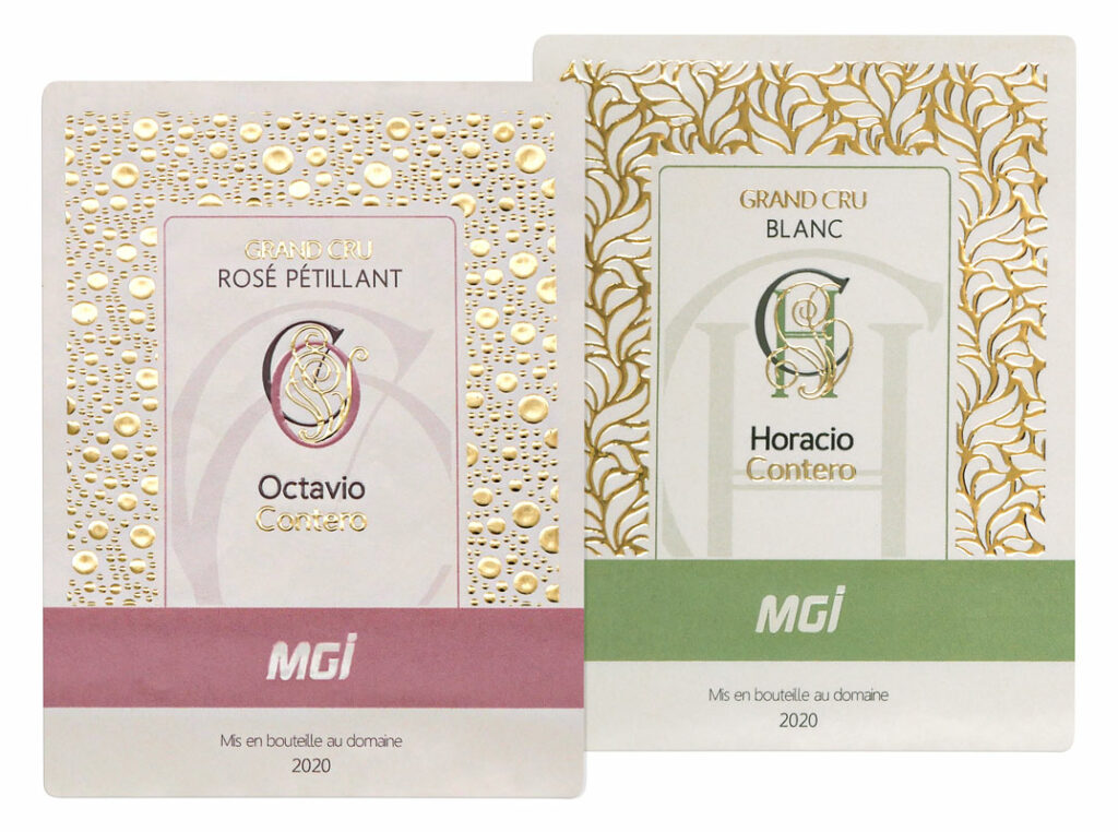 Photo of wine labels with an embellished monogram in gilding and varnish, as well as various geometric textures in gilding
