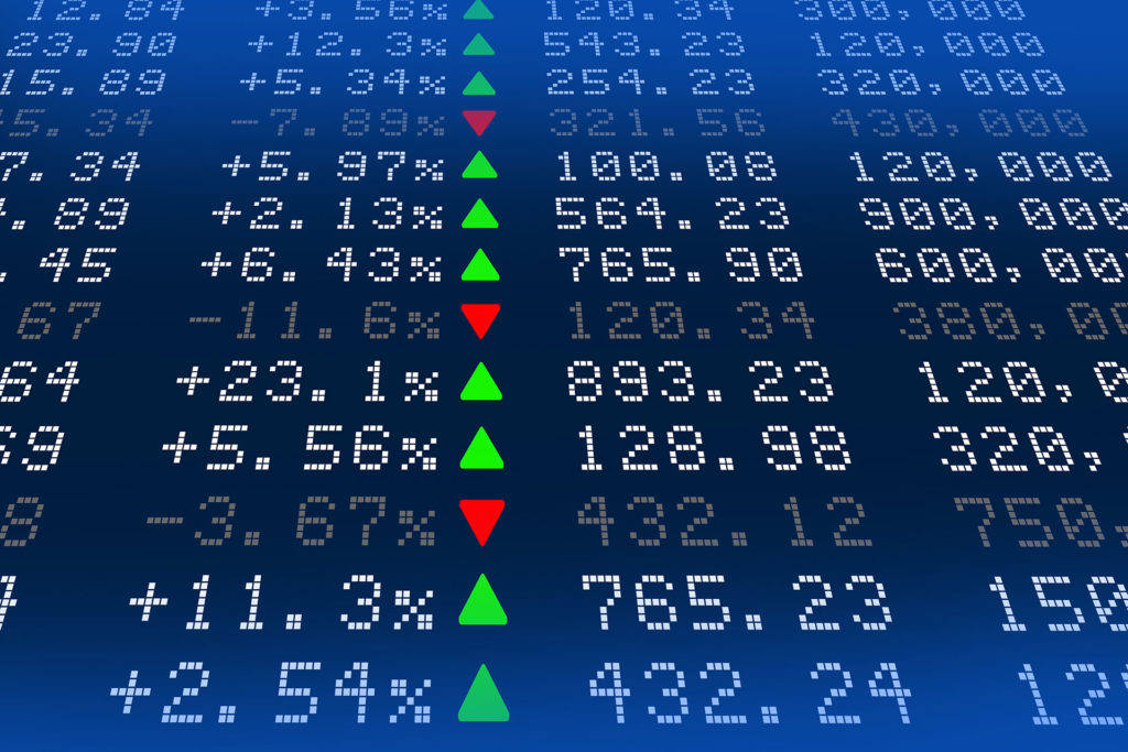 photo of white stock market numbers on a dark blue background