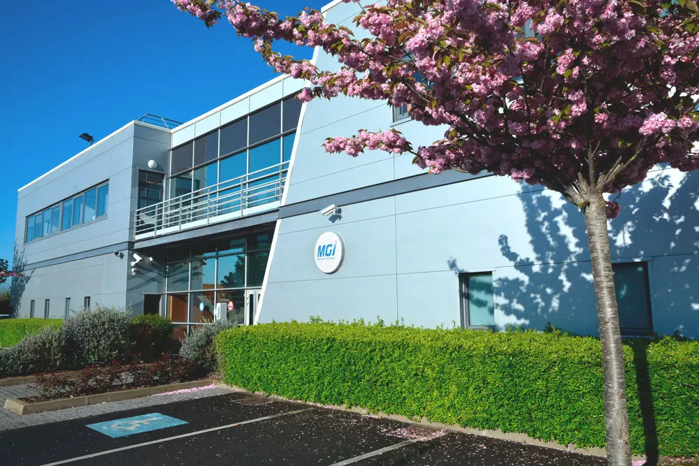 photo of the entrance to MGI Digital Technology headquarters with a cherry blossom tree