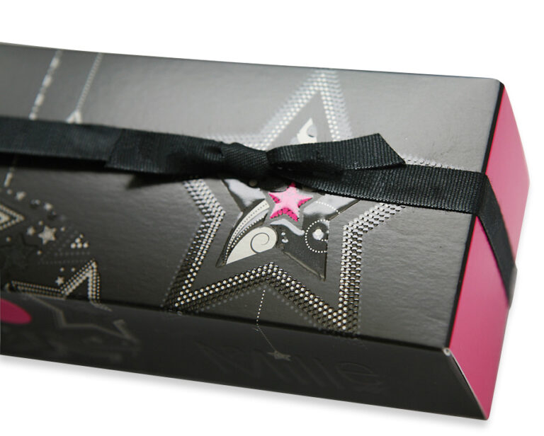 Photos of a black and pink embellished luxury packaging, with varnish - finishing on JETvarnish from MGI
