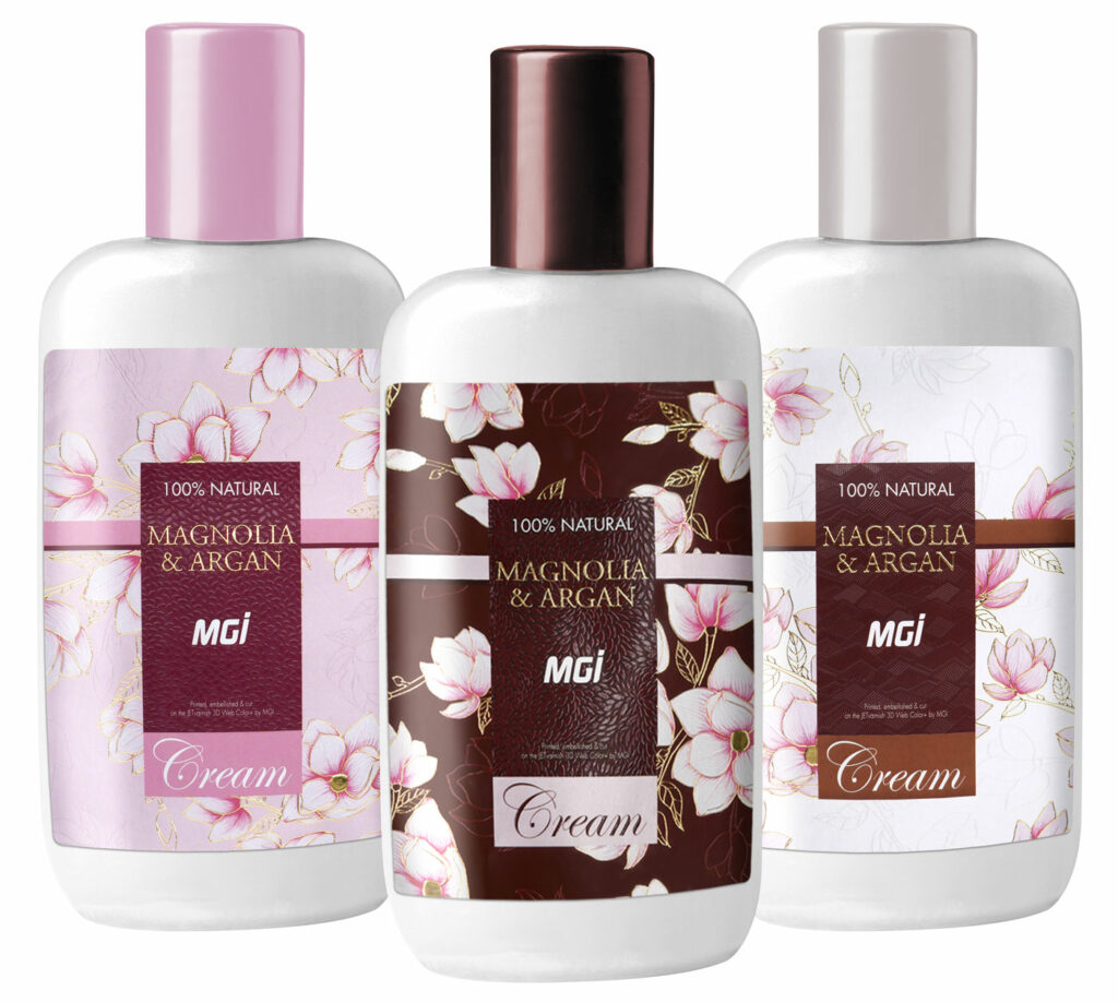 Photo of cosmetic label, with magnolia flowers in full color, varnish and gold, embellished text in varnish and gold - printing and finishing on a MGI Digital Technology press